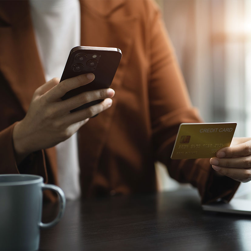 close up of person using their credit card