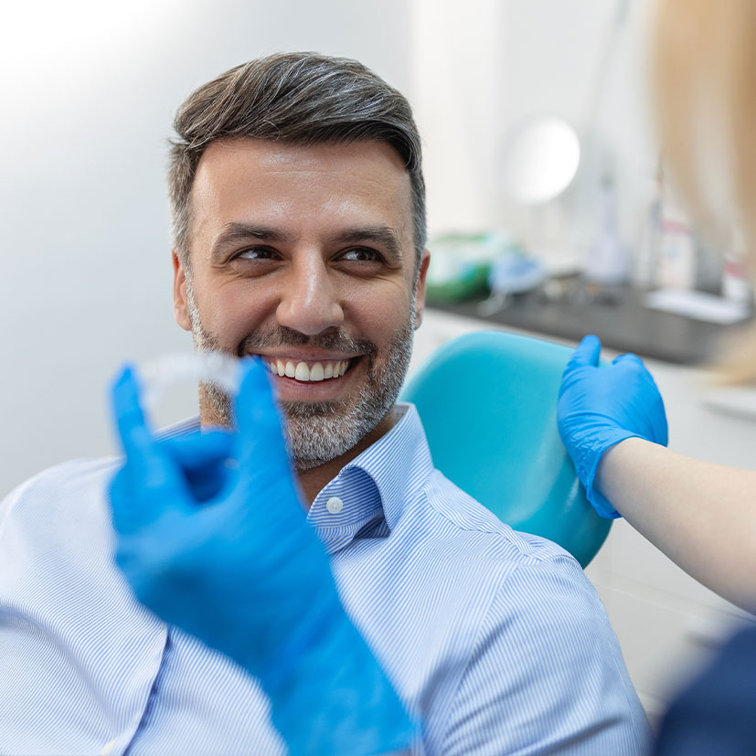 patient smiling and ready for Invisalign treatment