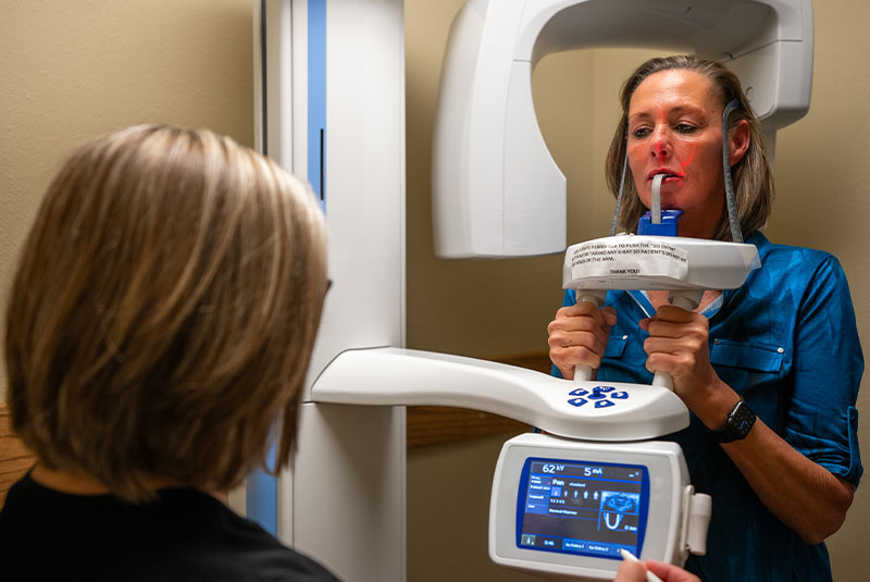 patient undergoing a cbct scan within the dental center