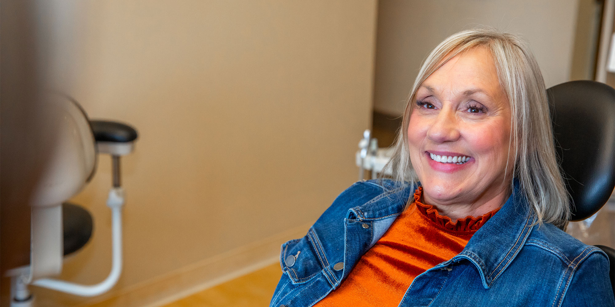 headshot of patient smiling and ready for dental treatment