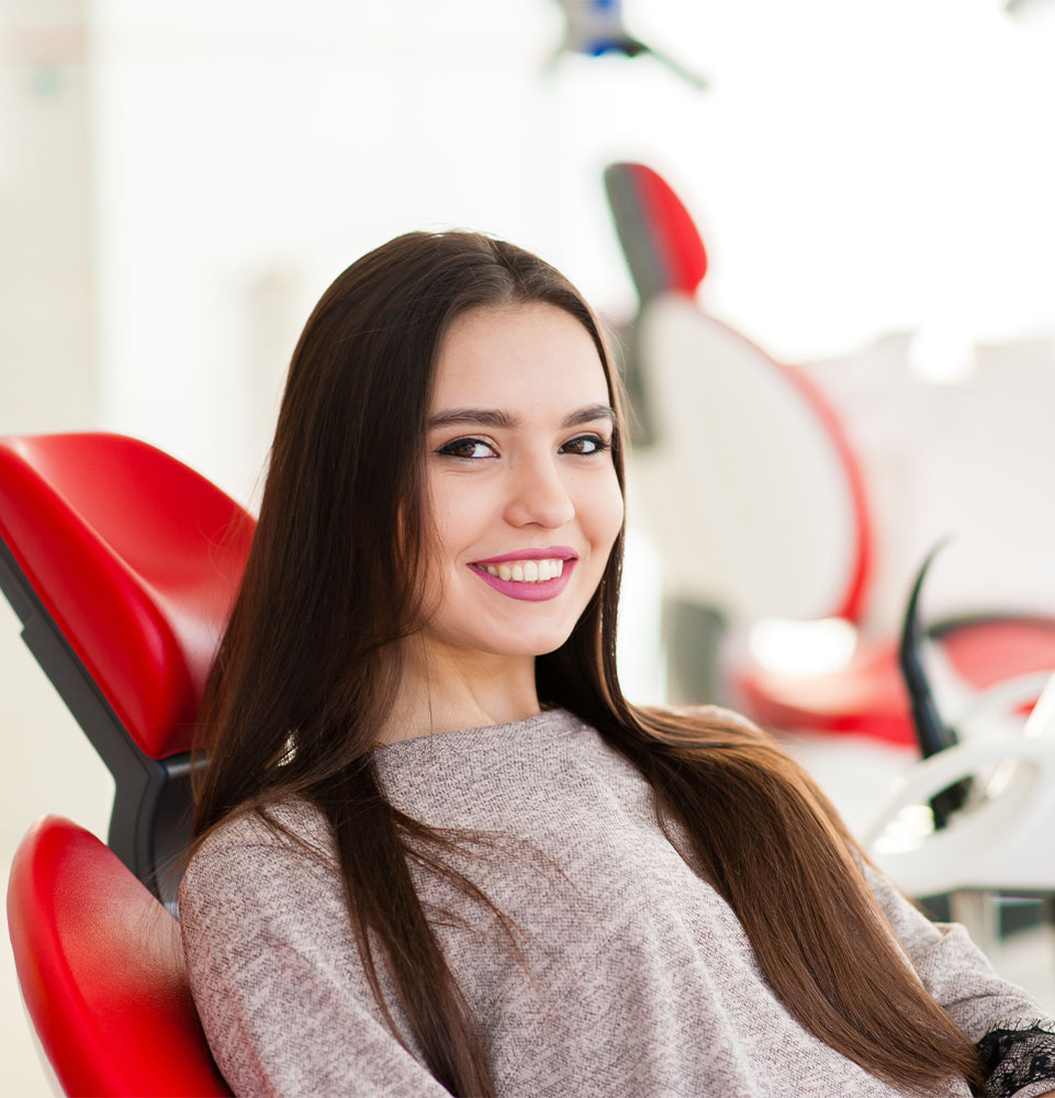 patient sitting in dental chair